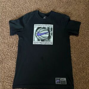 Nike Men's Black Tee with Purple Logo